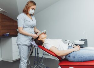 Dental technician administering nitrous oxide to a patient with dental anxiety.
